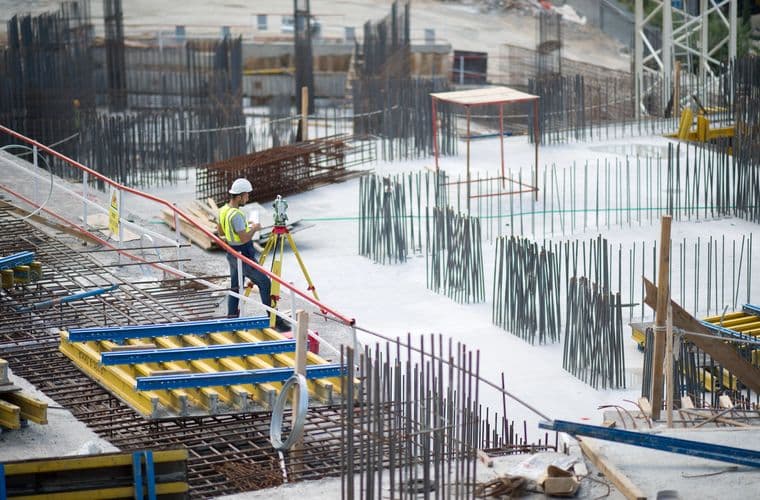 Reinforcement and formwork laid out across an open site