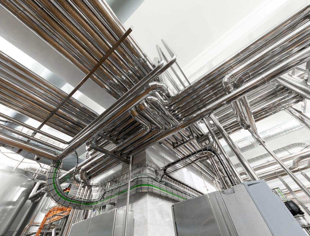 Process pipework and cable runs inside a plant